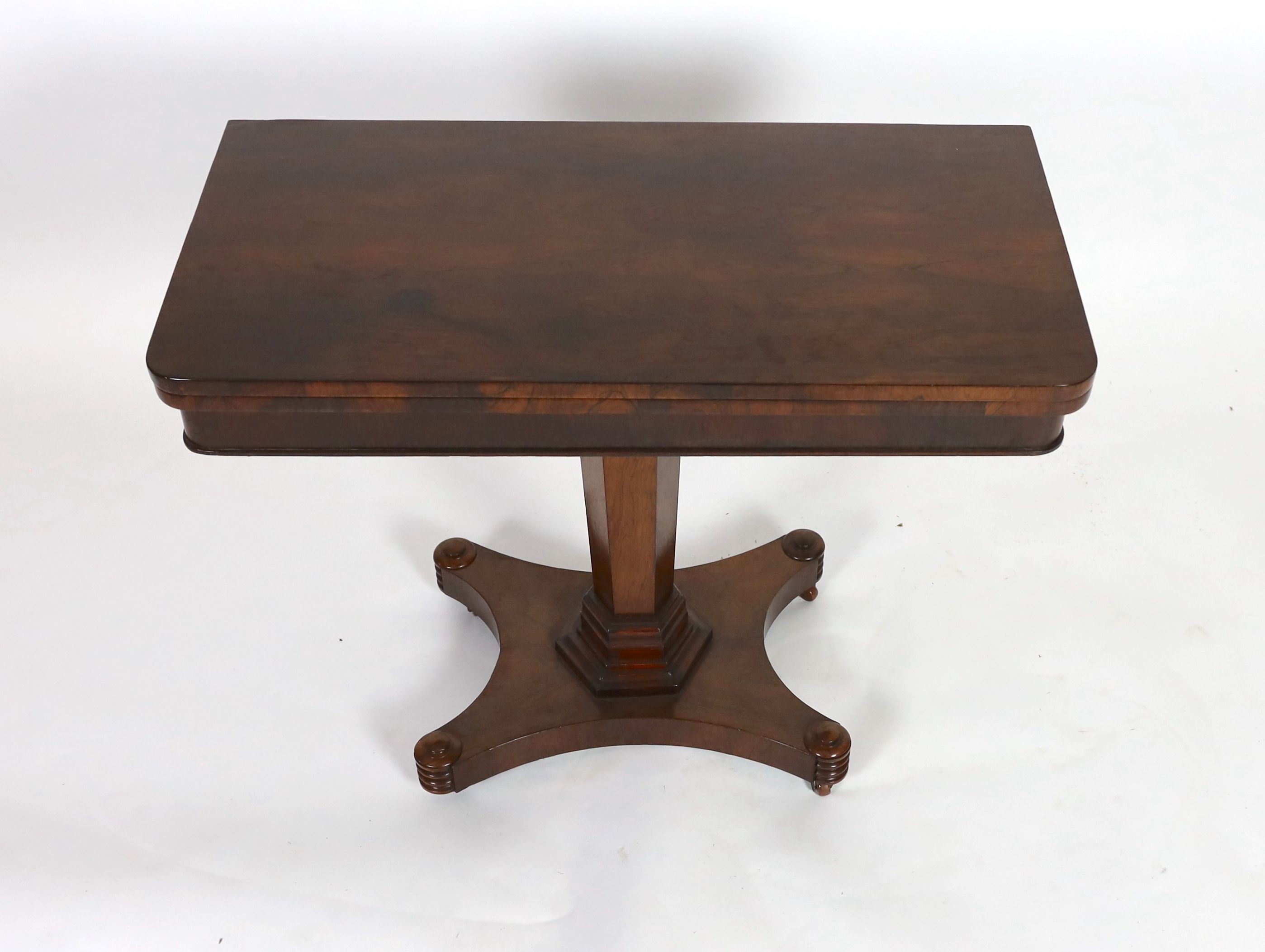 An early Victorian rectangular rosewood folding card table, on hexagonal column, width 92cm depth 46cm height 73cm